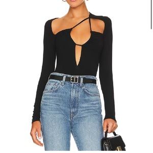 Worn 1x. Great top for going out! Strappy front with cut-out details